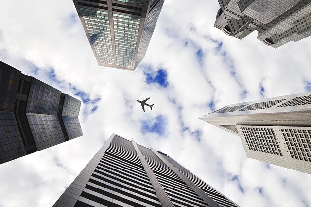 Airplane Over Skyscrapers image